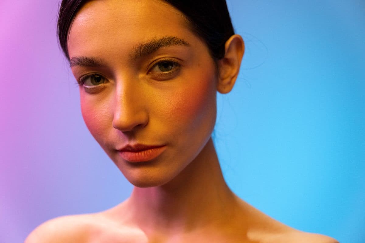 A close-up beauty portrait of a woman with smooth, healthy skin